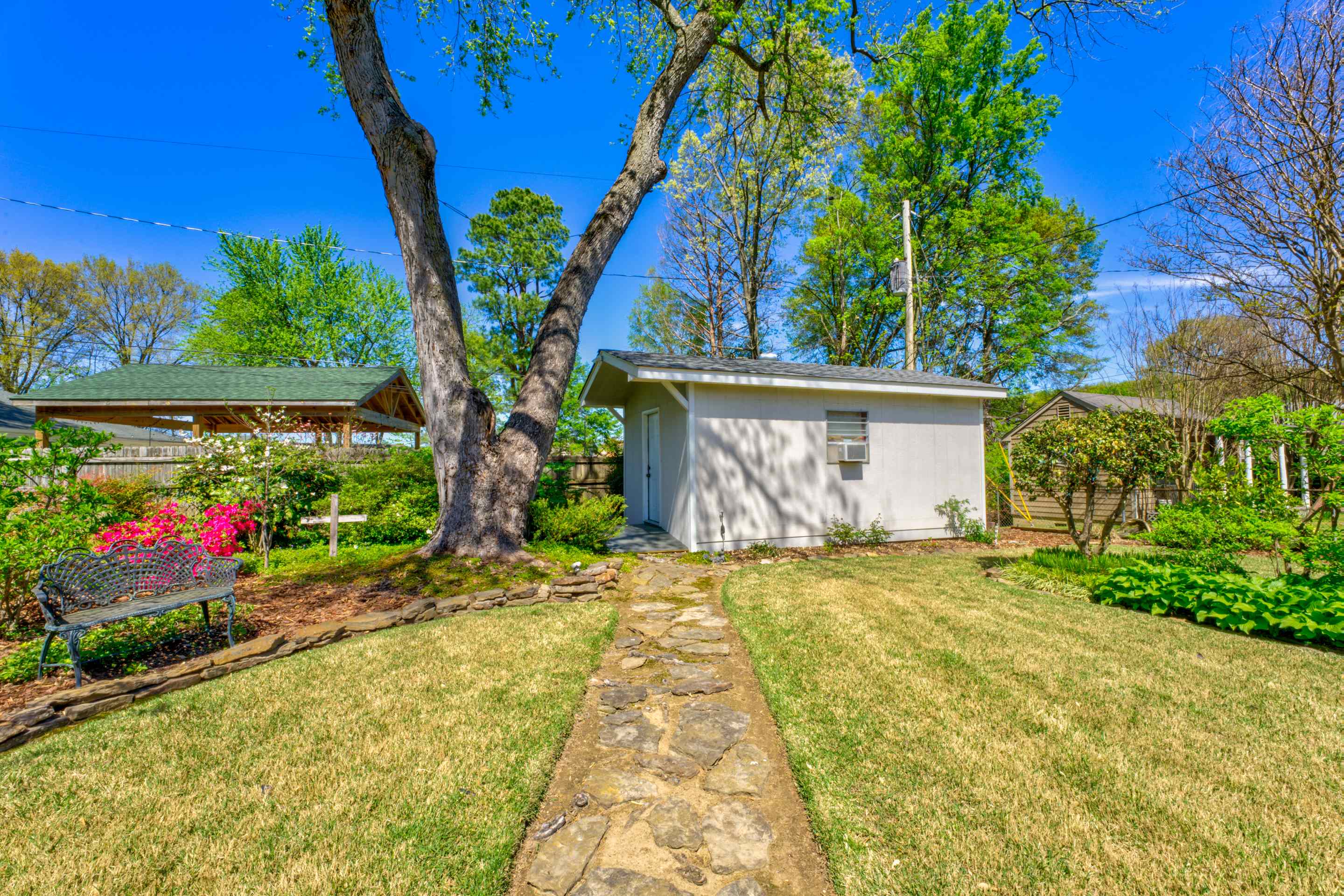 5564 Mason Road Memphis, TN 38120 - Photo 18 of 31 a view of a house with garden and plants