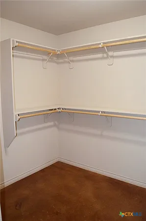 a view of an empty walk in closet
