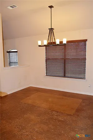 a view of a ceiling room with wooden floor