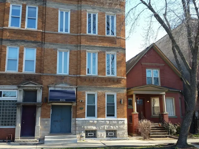 a front view of a building with glass windows