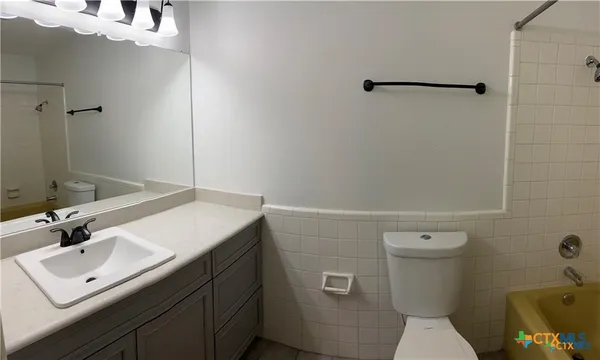 a view of a porch with wooden floor and fence
