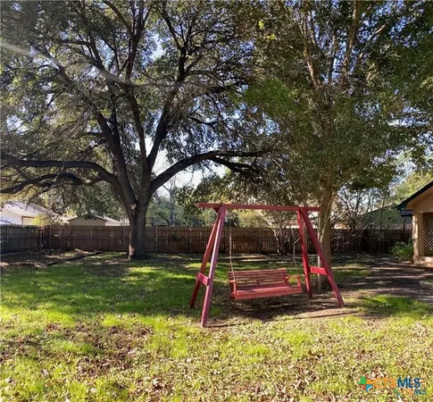 a view of a lake with a yard