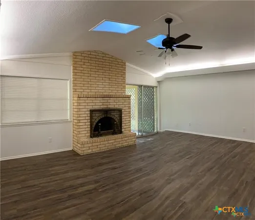 a kitchen with a stove and a refrigerator