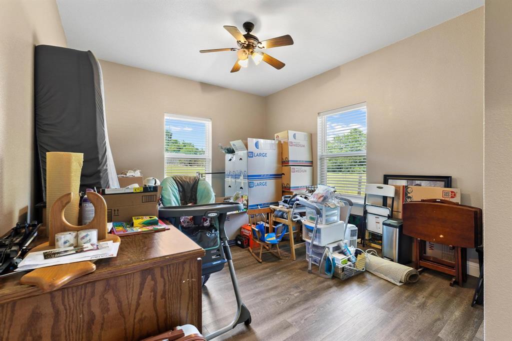 2658 Oak Ridge Road Denison, TX 75021 - Photo 25 of 37 a view of a workspace with furniture and a window