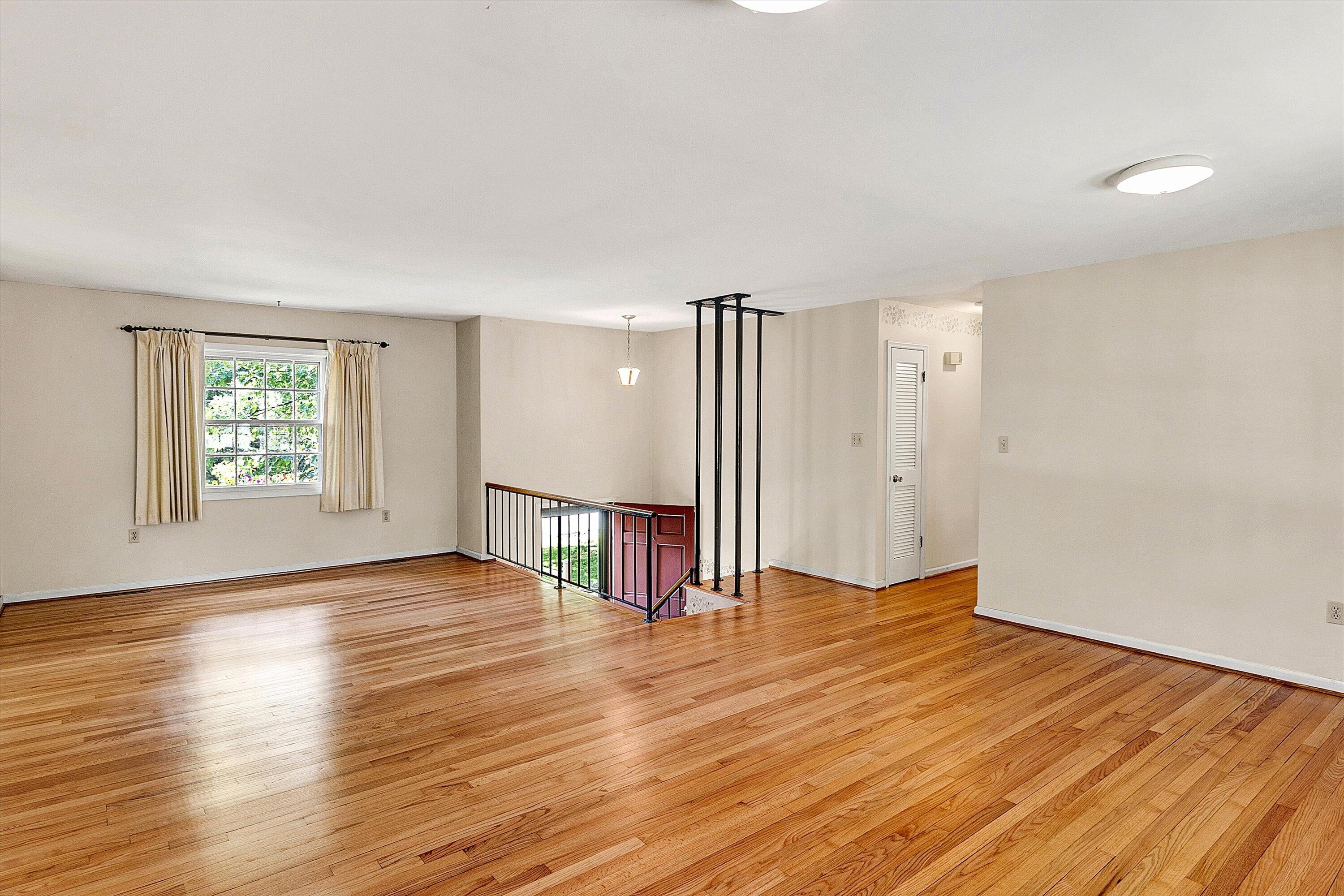 912 Cherokee Trail Covington, VA 24426 - Photo 5 of 31 an empty room with wooden floor and windows