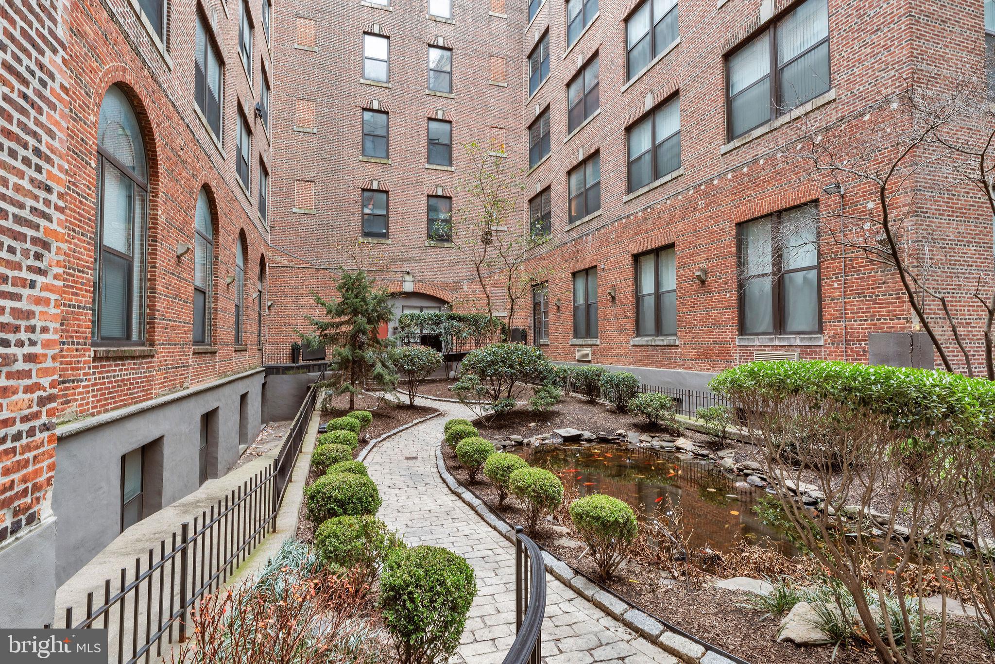 1100 South Broad Street, Unit 607B Philadelphia, PA 19146 - Photo 14 of 18 a view of a building with a yard