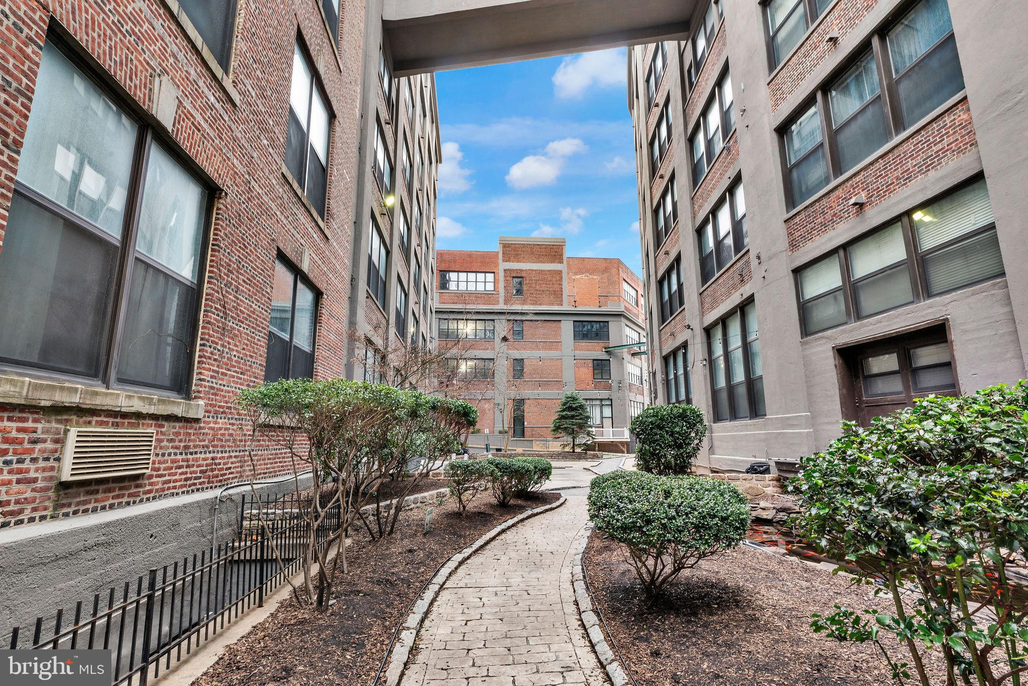 1100 South Broad Street, Unit 607B Philadelphia, PA 19146 - Photo 16 of 18 a view of a building with a yard