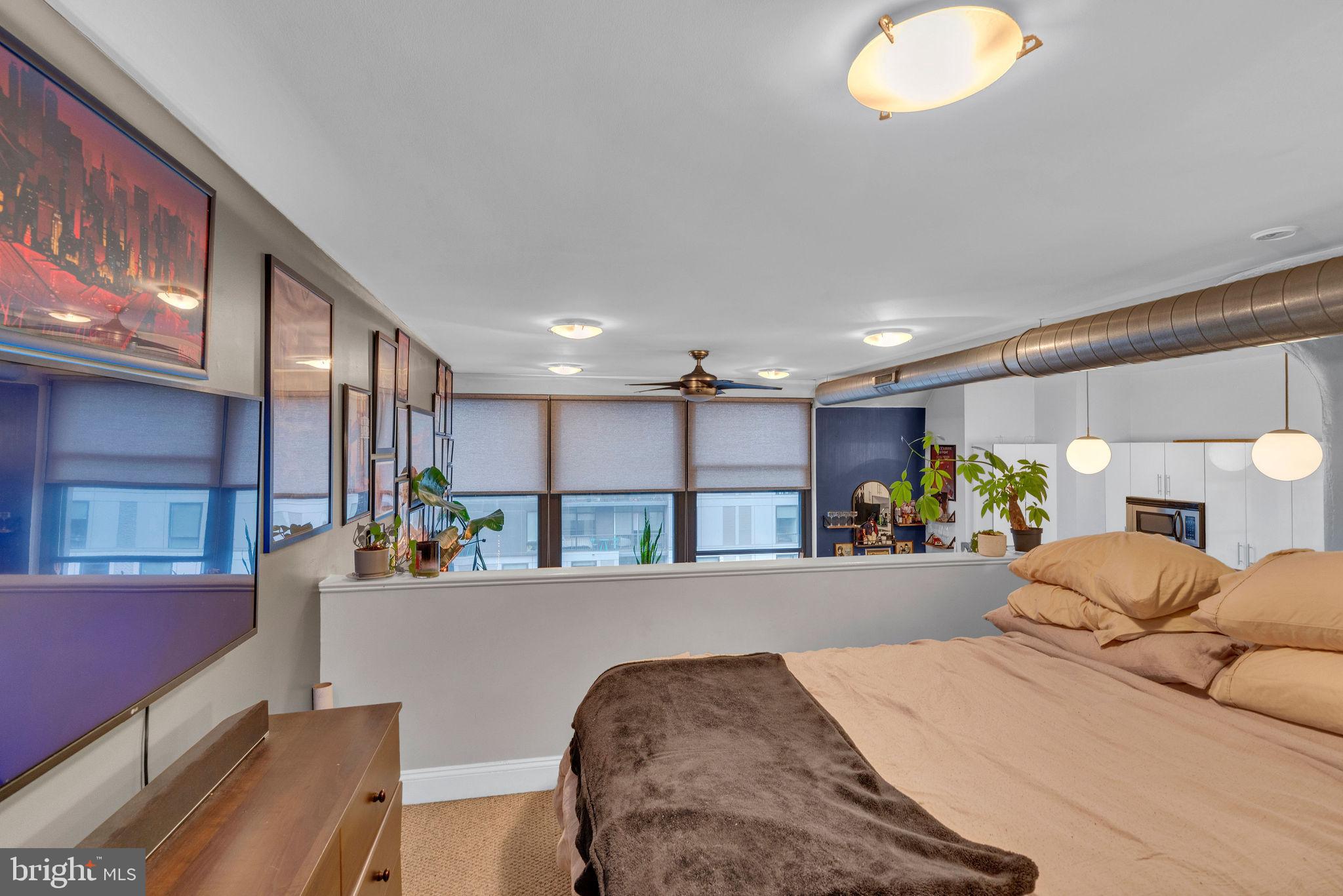 1100 South Broad Street, Unit 607B Philadelphia, PA 19146 - Photo 10 of 18 a large bedroom with a large bed and a large window