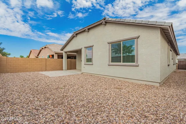 a house with trees in the background