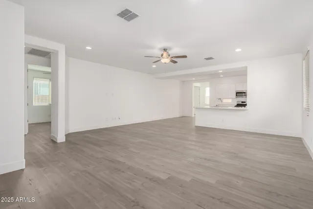 a view of a kitchen with marble kitchen and stainless steel appliances