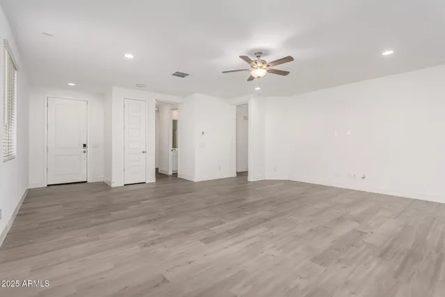 a view of empty room with fan