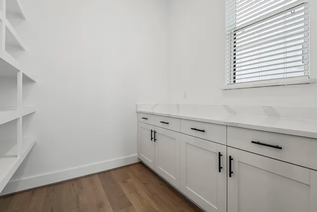 a view of cabinets and wooden floor