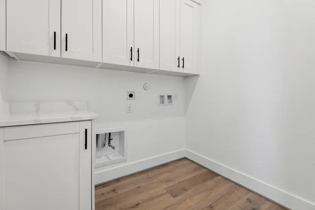 a view of cabinets and wooden floor