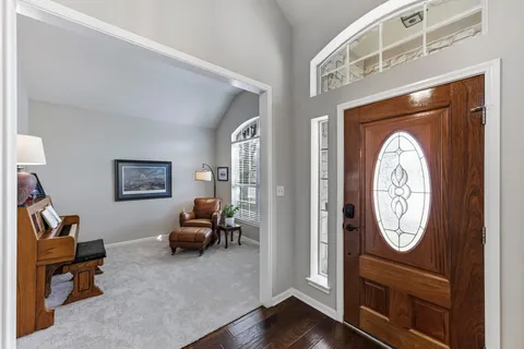 a view of living room with furniture and a window