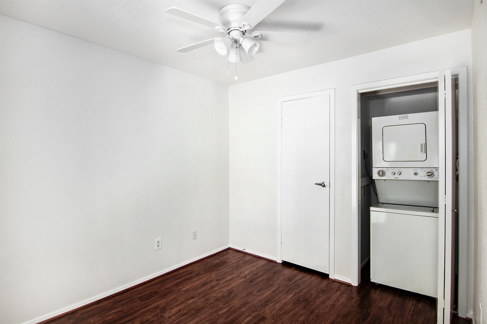 18519 Egret Bay Boulevard, Unit 1708 Webster, TX 77058 - Photo 11 of 27 an empty room with a hardwood and a ceiling fan