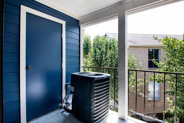 a view of a balcony with furniture