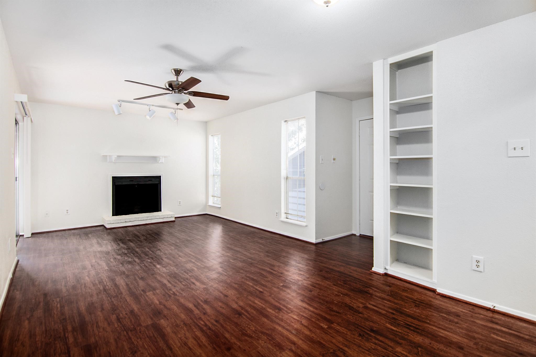 18519 Egret Bay Boulevard, Unit 1708 Webster, TX 77058 - Photo 3 of 27 a view of an empty room with a window and wooden floor