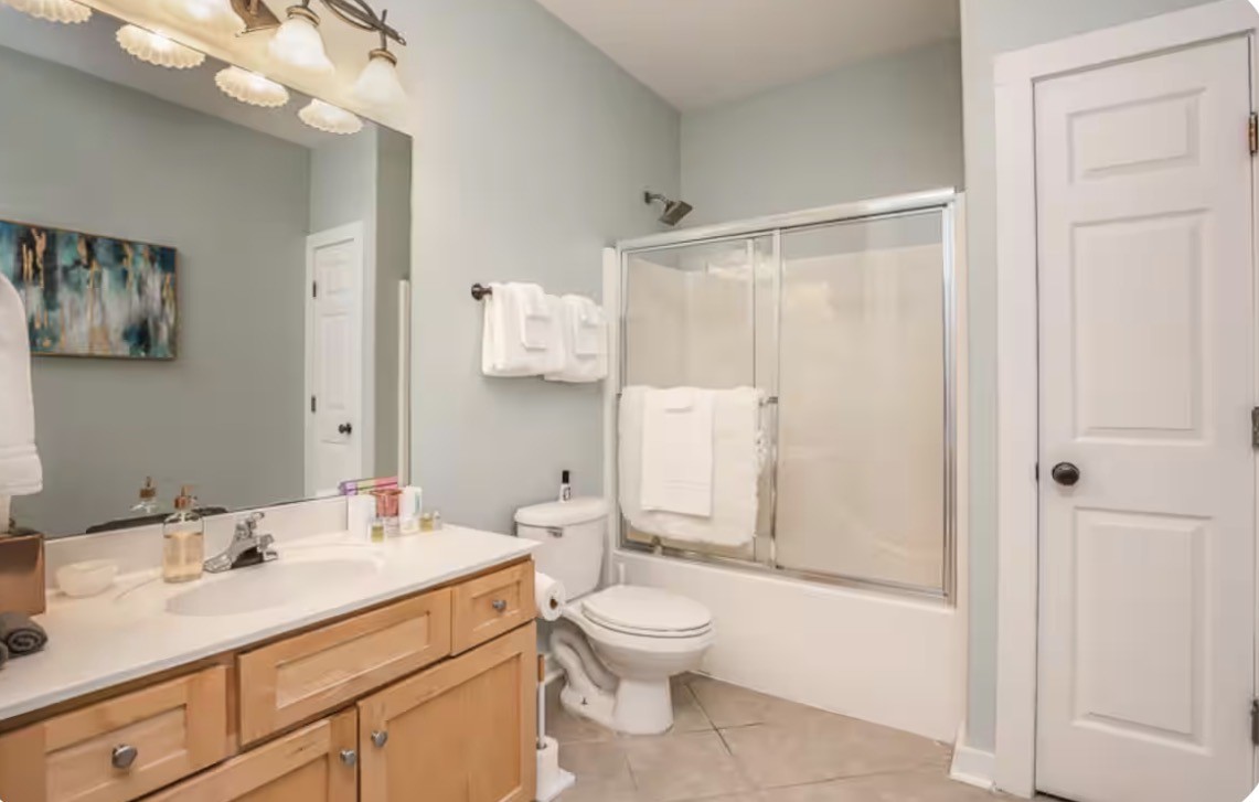 1437 Dividing Ridge Road Goodlettsville, TN 37072 - Photo 16 of 36 a bathroom with a sink toilet a mirror and shower