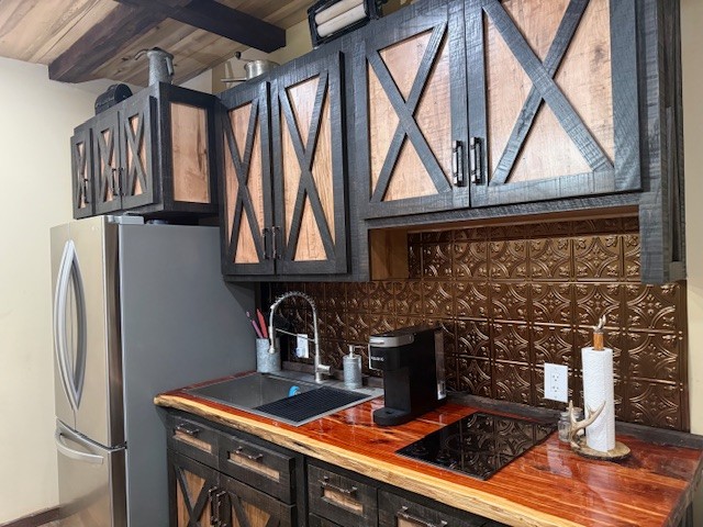 1437 Dividing Ridge Road Goodlettsville, TN 37072 - Photo 20 of 36 a kitchen with stainless steel appliances granite countertop a stove a refrigerator and a wooden cabinets