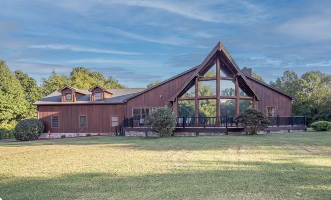1437 Dividing Ridge Road Goodlettsville, TN 37072 - Photo 2 of 36 a front view of a house with a yard table and chairs