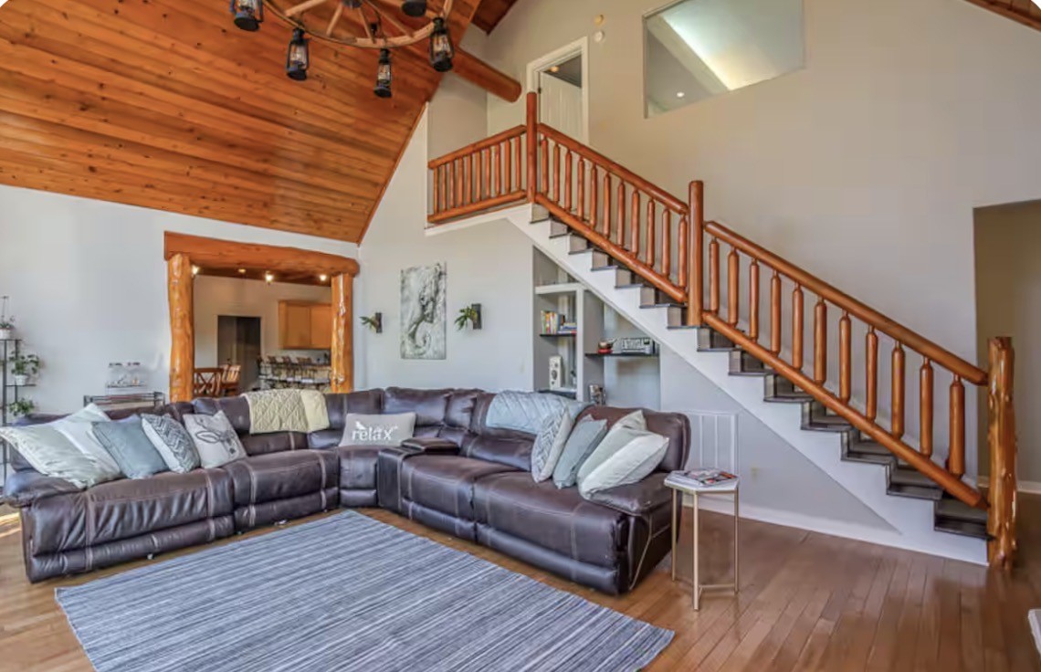 1437 Dividing Ridge Road Goodlettsville, TN 37072 - Photo 4 of 36 a living room with wooden floor and a chandelier