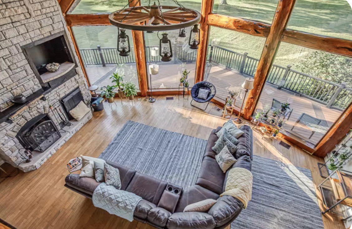 1437 Dividing Ridge Road Goodlettsville, TN 37072 - Photo 5 of 36 a living room with furniture a flat screen tv and a fireplace