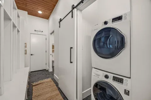 a view of a hallway with washer and dryer