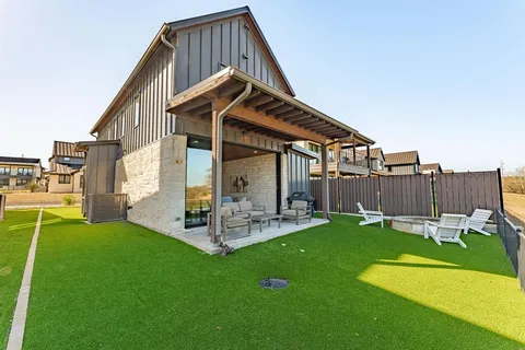 a view of a house with a yard porch and sitting area
