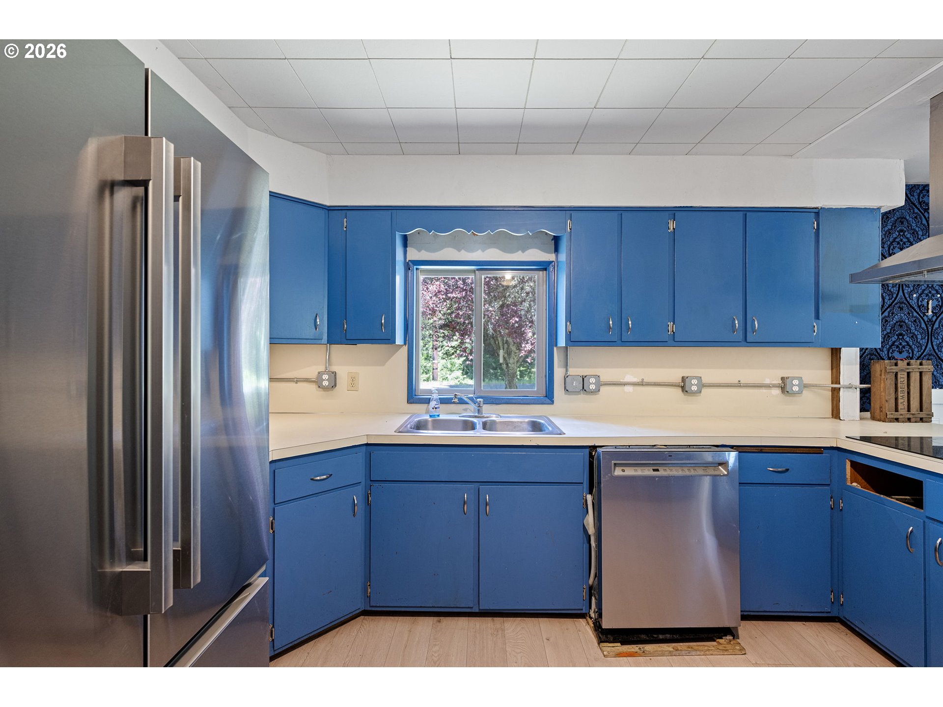 77521 Brock Road Oakridge, OR 97463 - Photo 13 of 48 a kitchen with a sink and cabinets