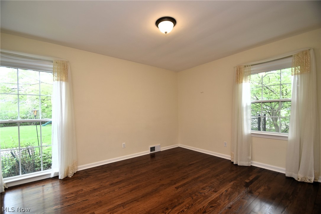 23901 Hazelmere Road Shaker Heights, OH 44122 - Photo 19 of 35 Spare room with dark hardwood / wood-style flooring and plenty of natural light