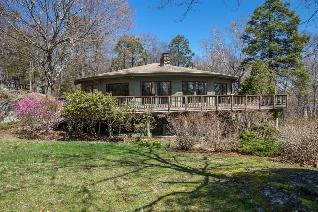 344 West River Road Orange, CT 06477 - Photo 1 of 1 Dramatic living room and dining room with wrap around deck