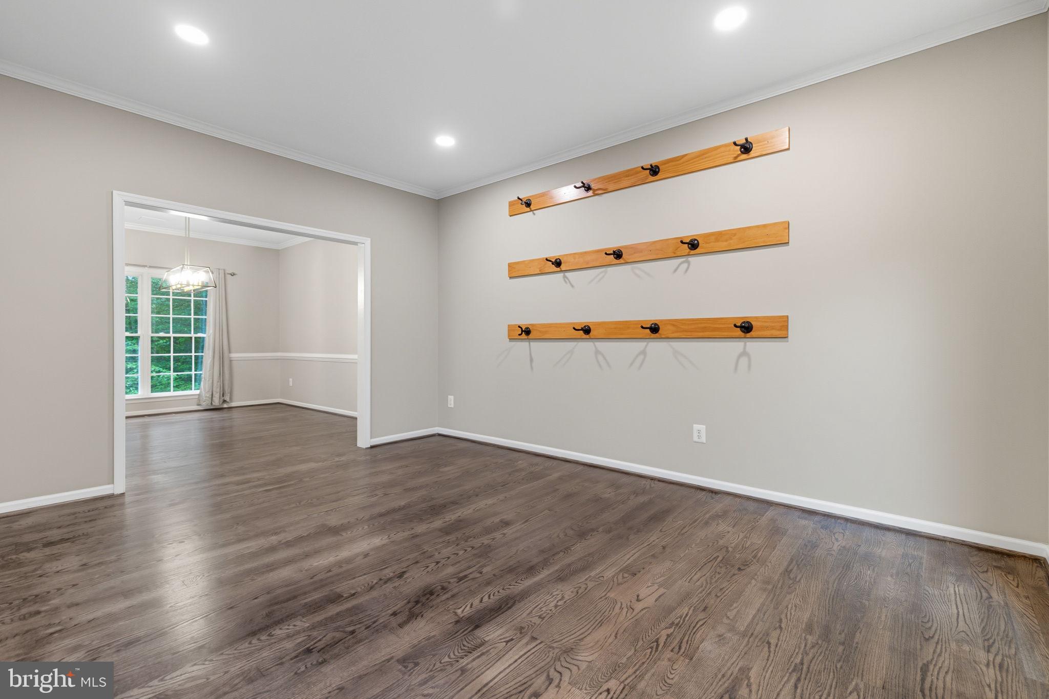 6363 Yates Ford Road Manassas, VA 20111 - Photo 11 of 67 an empty room with wooden floor and windows