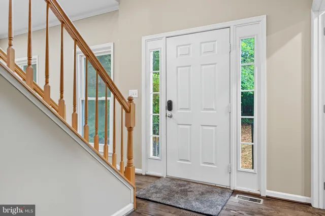 a view of an entryway with wooden floor
