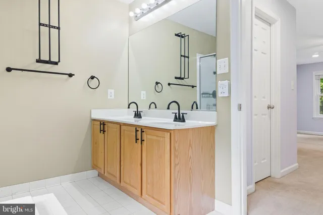 a bathroom with a shower and vanity