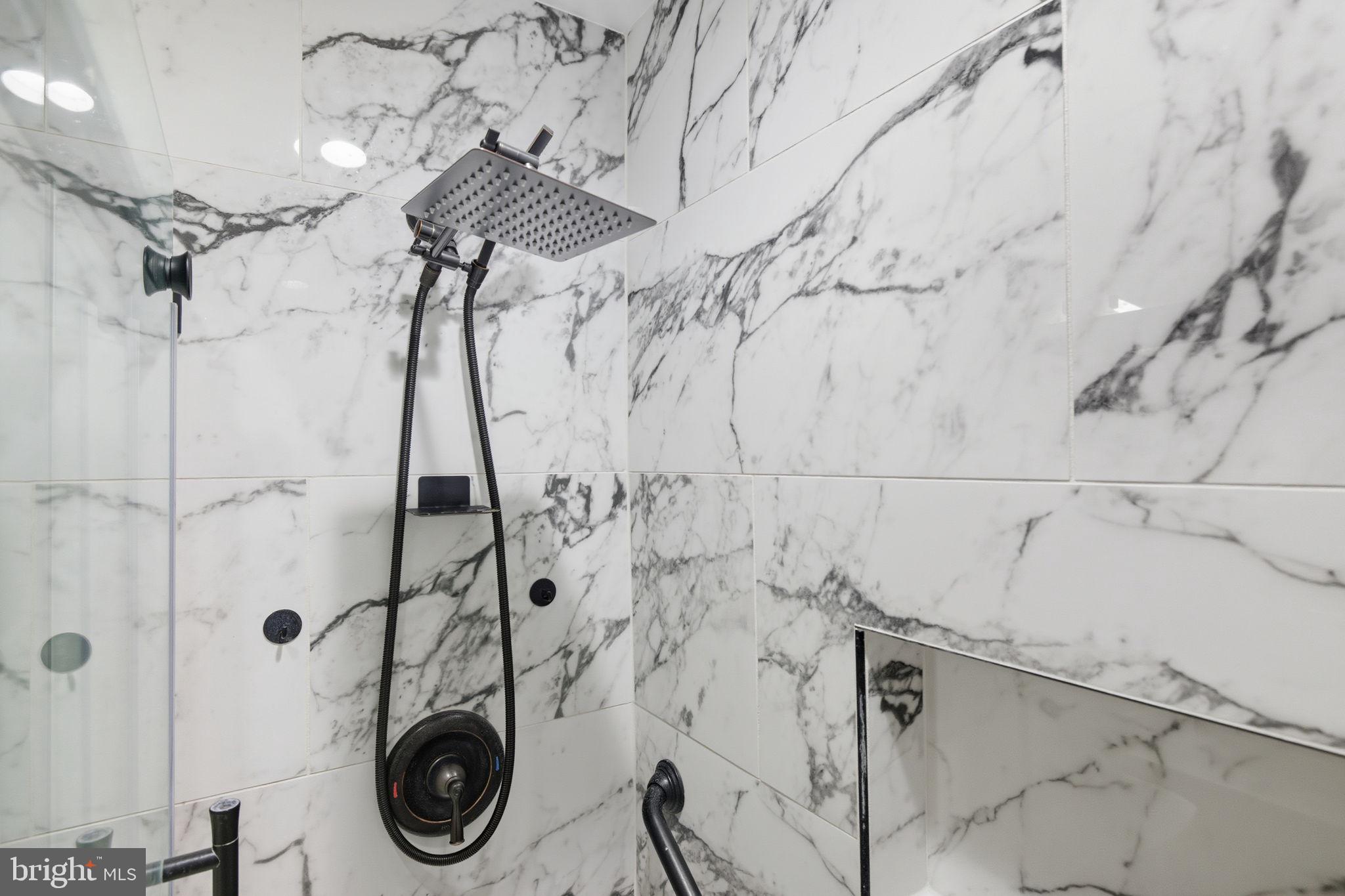 6363 Yates Ford Road Manassas, VA 20111 - Photo 34 of 67 a bathroom with a shower and vanity