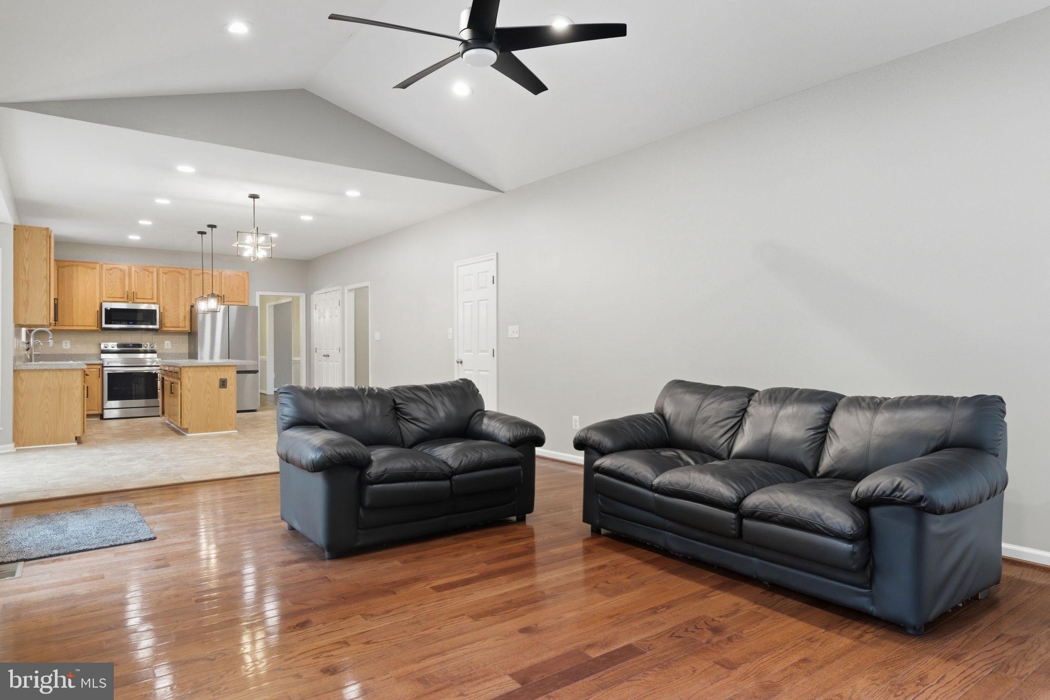 6363 Yates Ford Road Manassas, VA 20111 - Photo 38 of 67 a living room with furniture and kitchen view