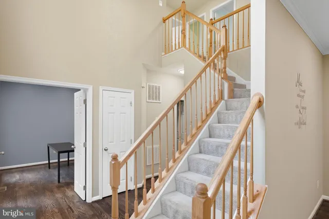 a view of a room with a table and chairs