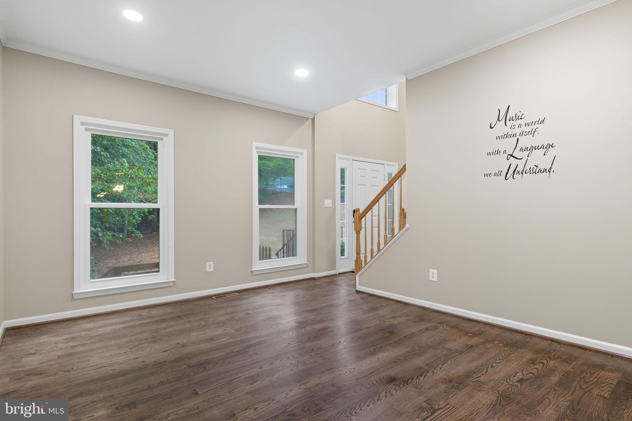 6363 Yates Ford Road Manassas, VA 20111 - Photo 10 of 67 a view of an empty room with wooden floor and a window