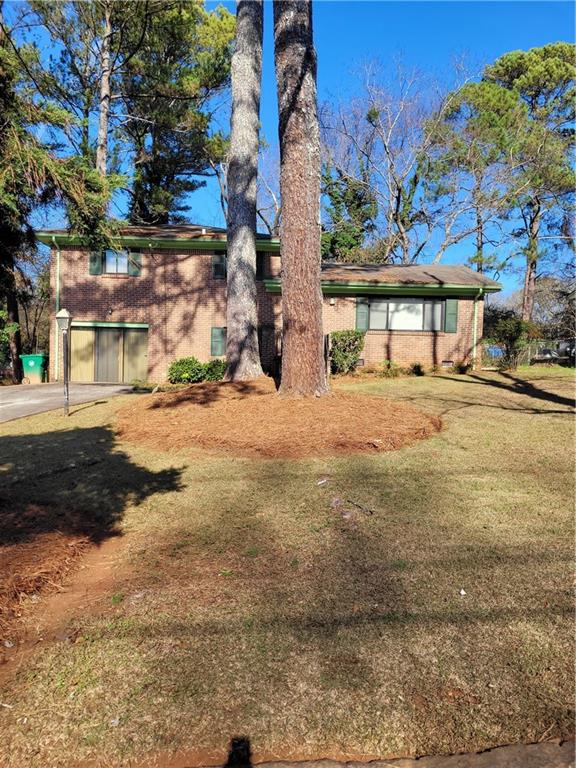 3626 Mecklinburg Place Decatur, GA 30032 - Photo 1 of 1 a row of palm trees in front of a building