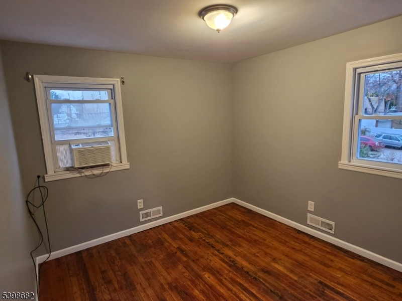 97 Goodwin Avenue Newark, NJ 07112 - Photo 15 of 20 a room with a wooden floor and a window