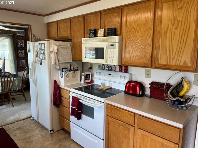 3998 Franklin Boulevard Eugene, OR 97403 - Photo 16 of 35 a kitchen with a refrigerator a stove a sink and cabinets