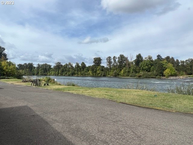 3998 Franklin Boulevard Eugene, OR 97403 - Photo 2 of 35 a view of a lake with houses in the back