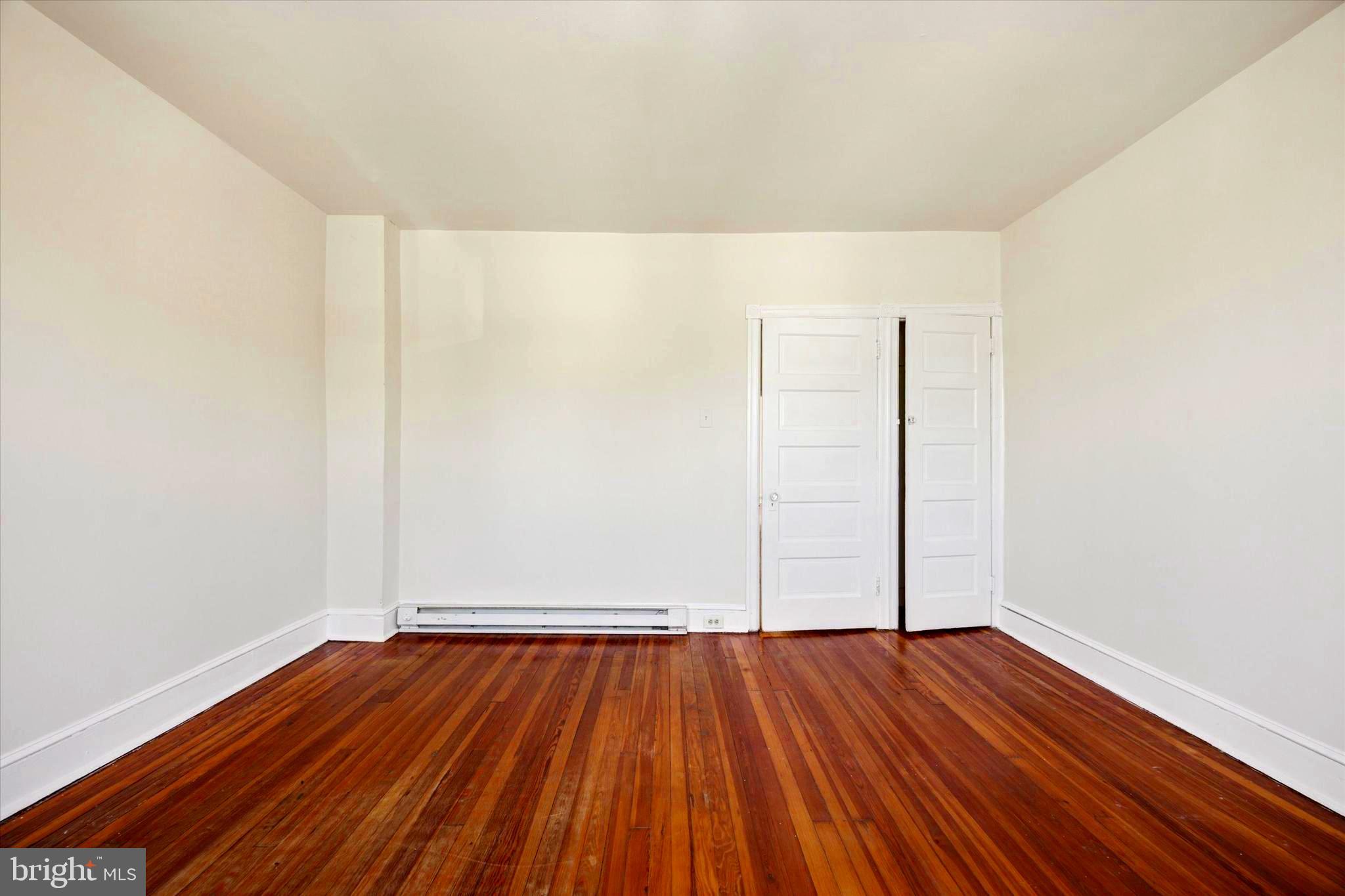 1549 North Wanamaker Street Philadelphia, PA 19131 - Photo 14 of 15 a view of an empty room with wooden floor
