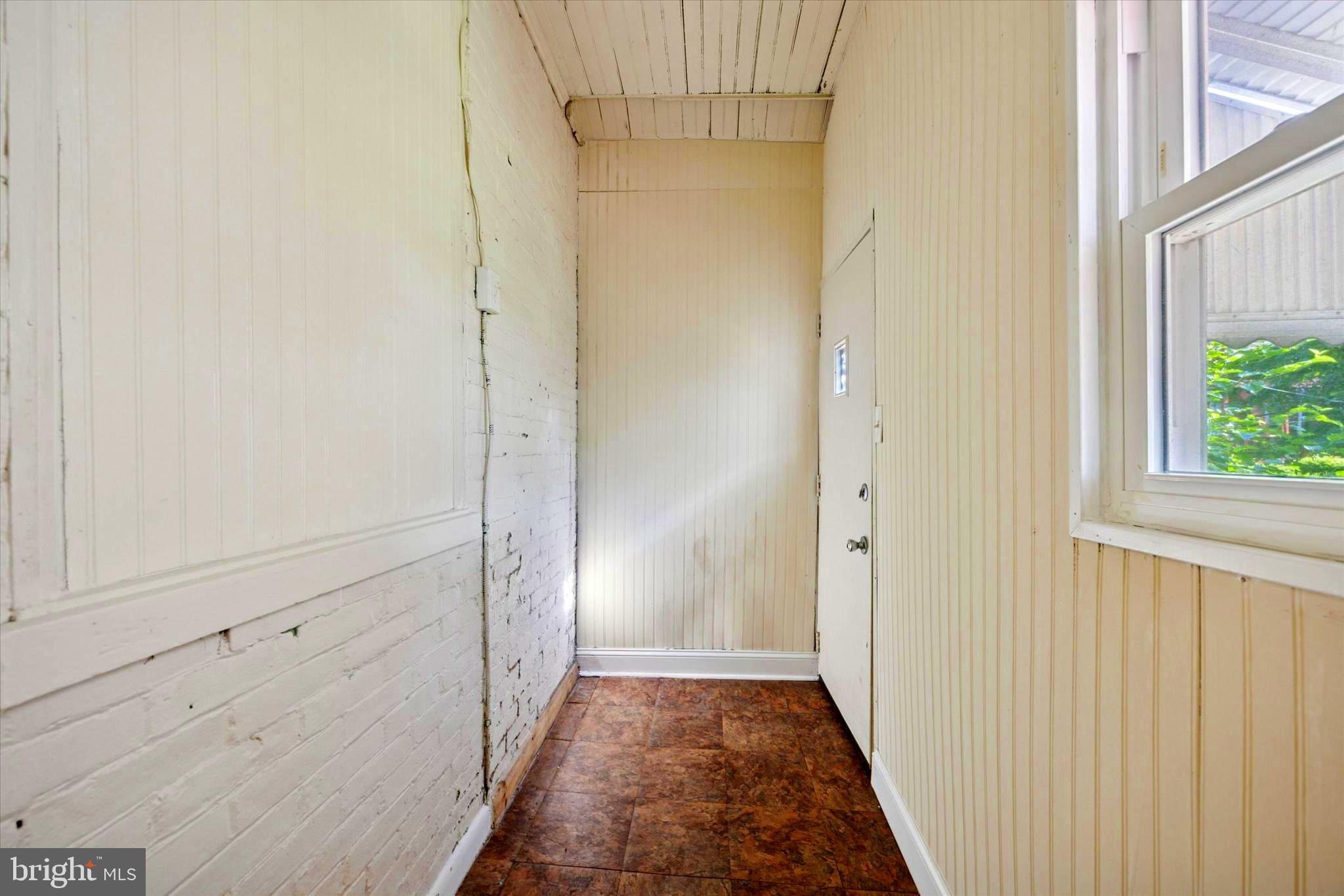 1549 North Wanamaker Street Philadelphia, PA 19131 - Photo 8 of 15 a view of hallway with window and wooden floor