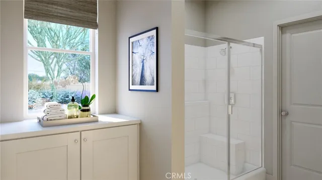 a bathroom with a window a sink and a mirror