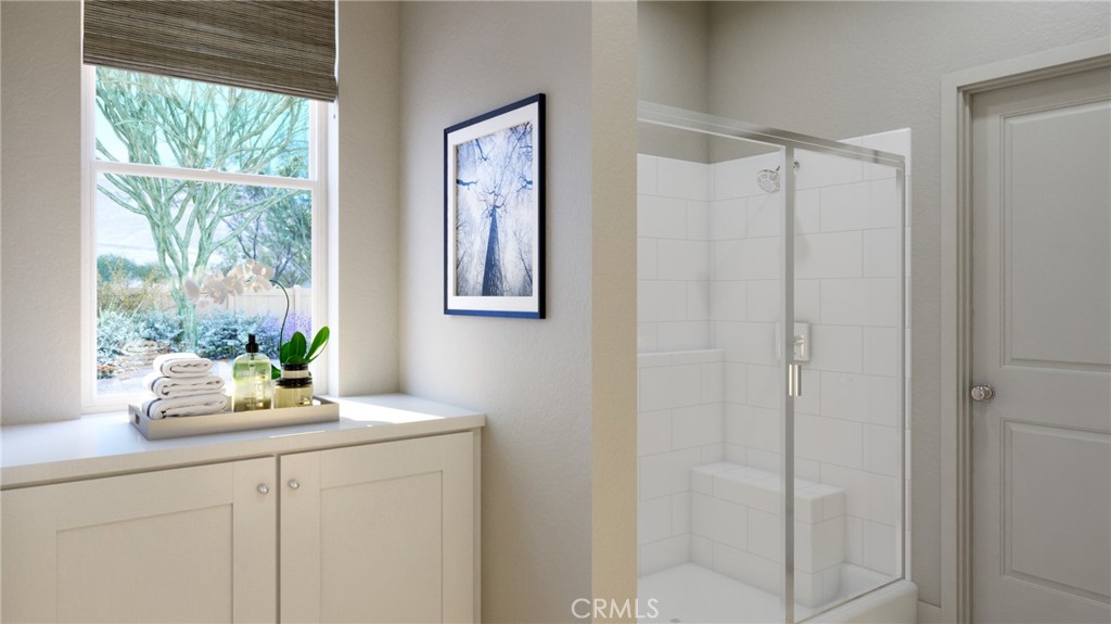 4072 Daisy Lane Banning, CA 92220 - Photo 15 of 15 a bathroom with a window a sink and a mirror