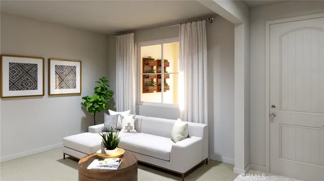 a living room with furniture and a potted plant