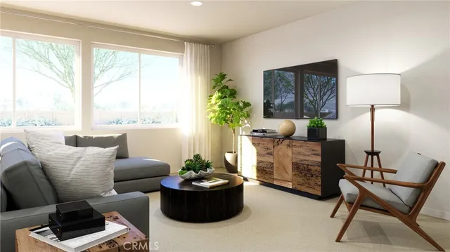 a living room with furniture and a large window