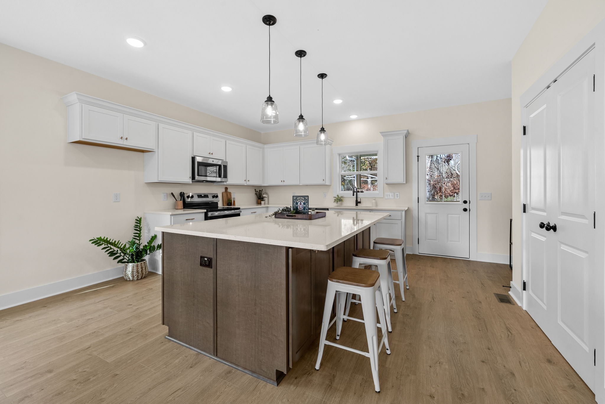 194 Dewberry Road Clarksville, TN 37042 - Photo 14 of 62 a kitchen with white cabinets and stainless steel appliances