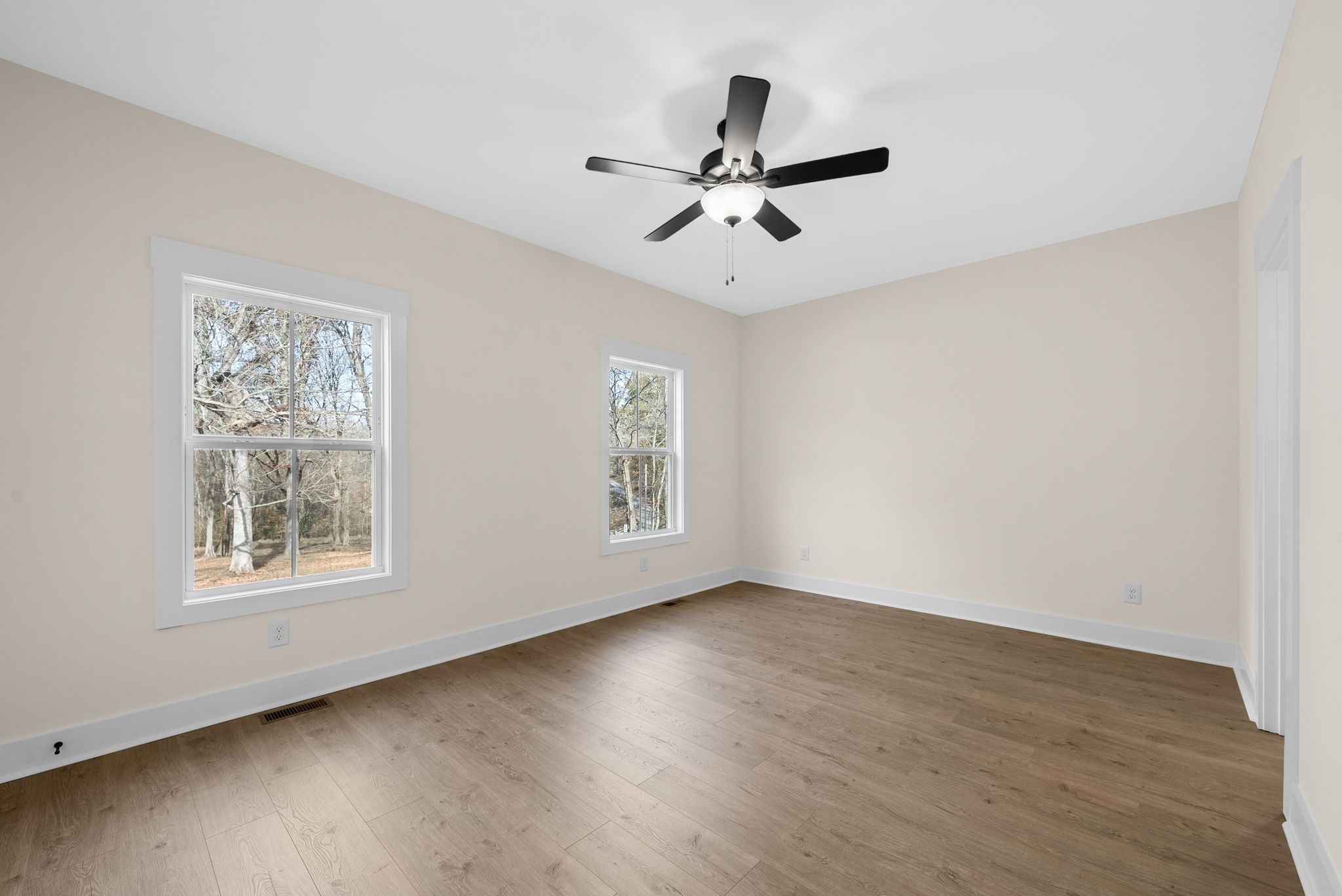 194 Dewberry Road Clarksville, TN 37042 - Photo 24 of 62 a view of an empty room with wooden floor and a window